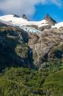 Chile, Beagle Channel, Alberto de Agostini NP. Landscape with mountain and glacier waterfall. Art Print